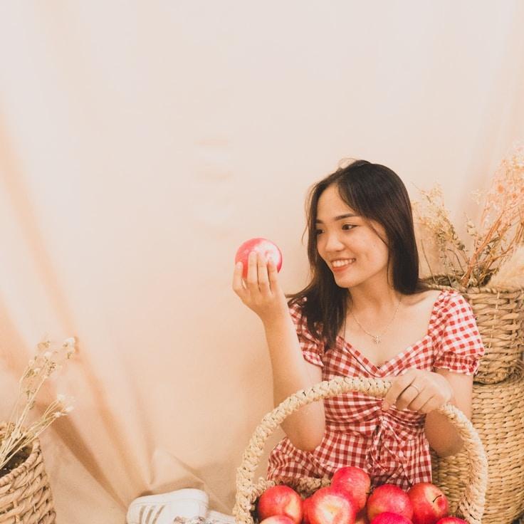 Avery Chen, Lead Design Curator at BeaconRidgeLane, reviewing corporate floral arrangements